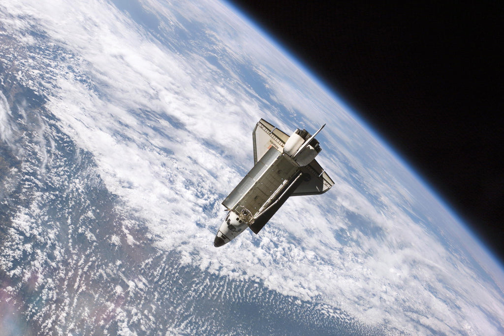 The Space Shuttle Atlantis over Earth