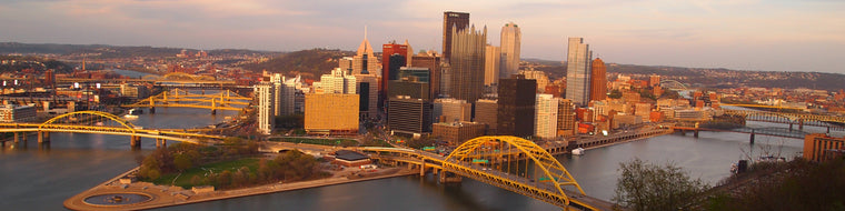 DOWNTOWN PITTSBURGH SKYLINE WITH SUNSET
